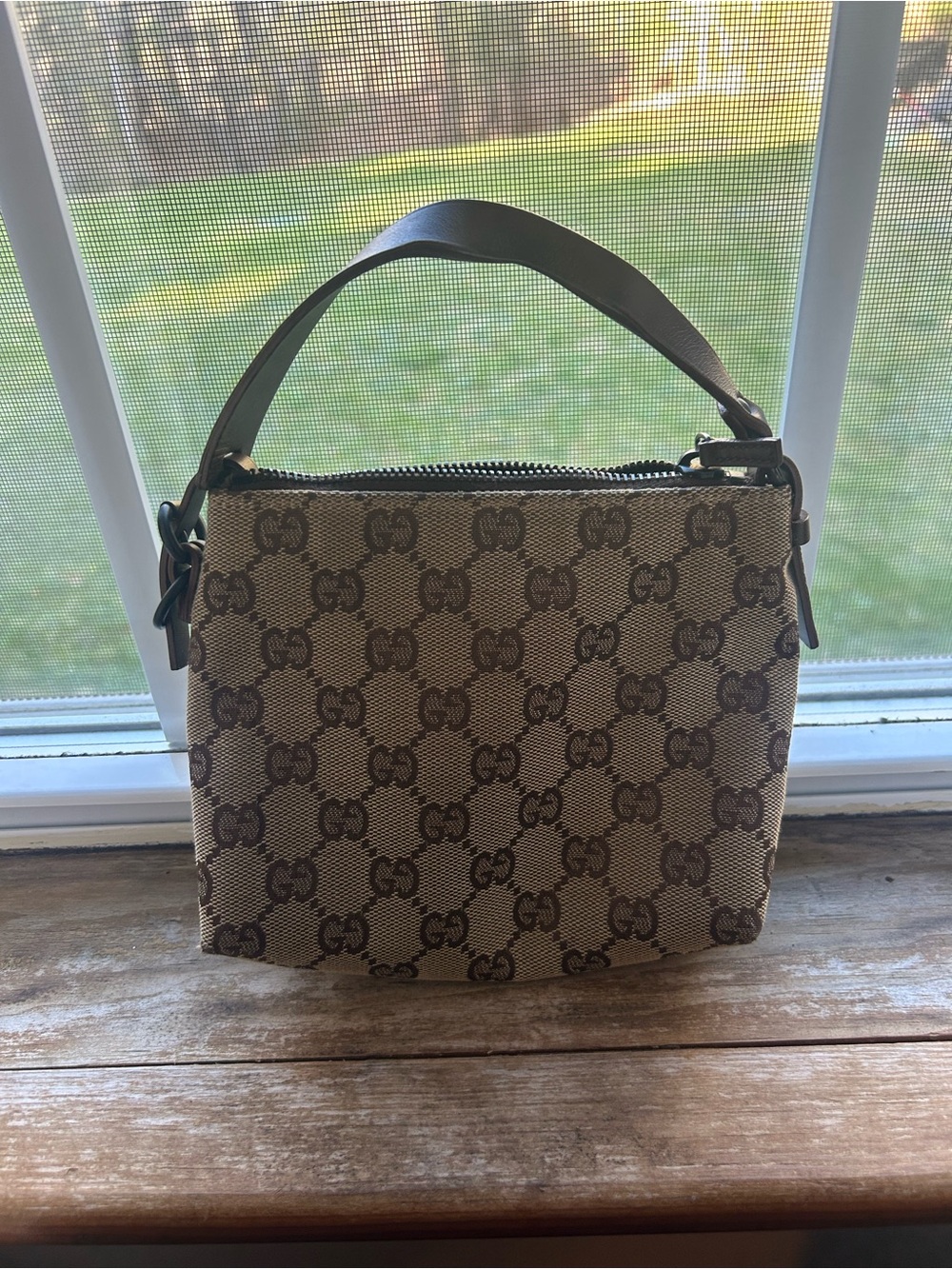 Gucci Beige and Brown Monogram small wrist bag. - Picture 3 of 4
